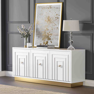 White 3-door sideboard with decorative items against a gray wall