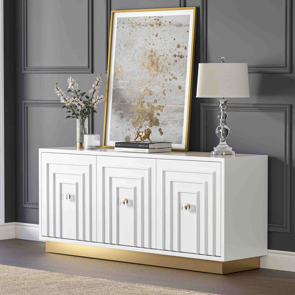 White 3-door sideboard with decorative items against a gray wall
