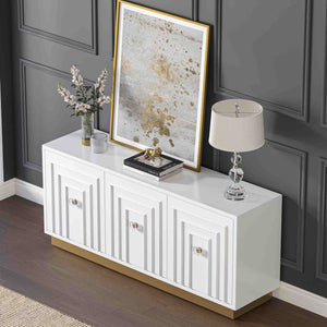 White 3-door sideboard with decorative items against a dark paneled wall