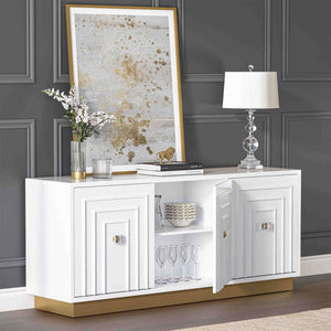 White 3-door sideboard with decorative items against a gray wall