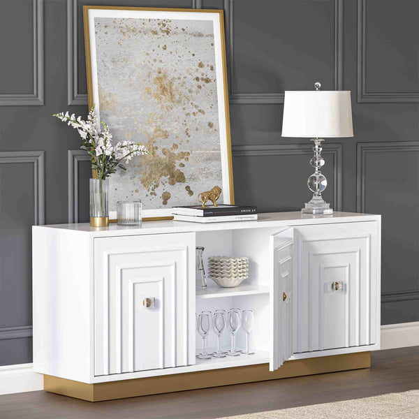 White 3-door sideboard with decorative items against a gray wall