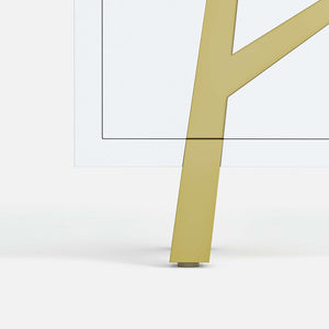 Gold metal leg of a 4-door sideboard on a white background