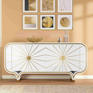Decorative modern 4-door buffet with gold accents against a wall with framed art.