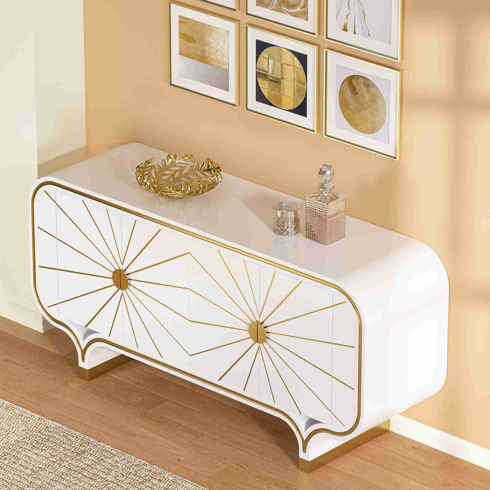 Decorative modern 4-door buffet with gold accents against a wall with framed art.